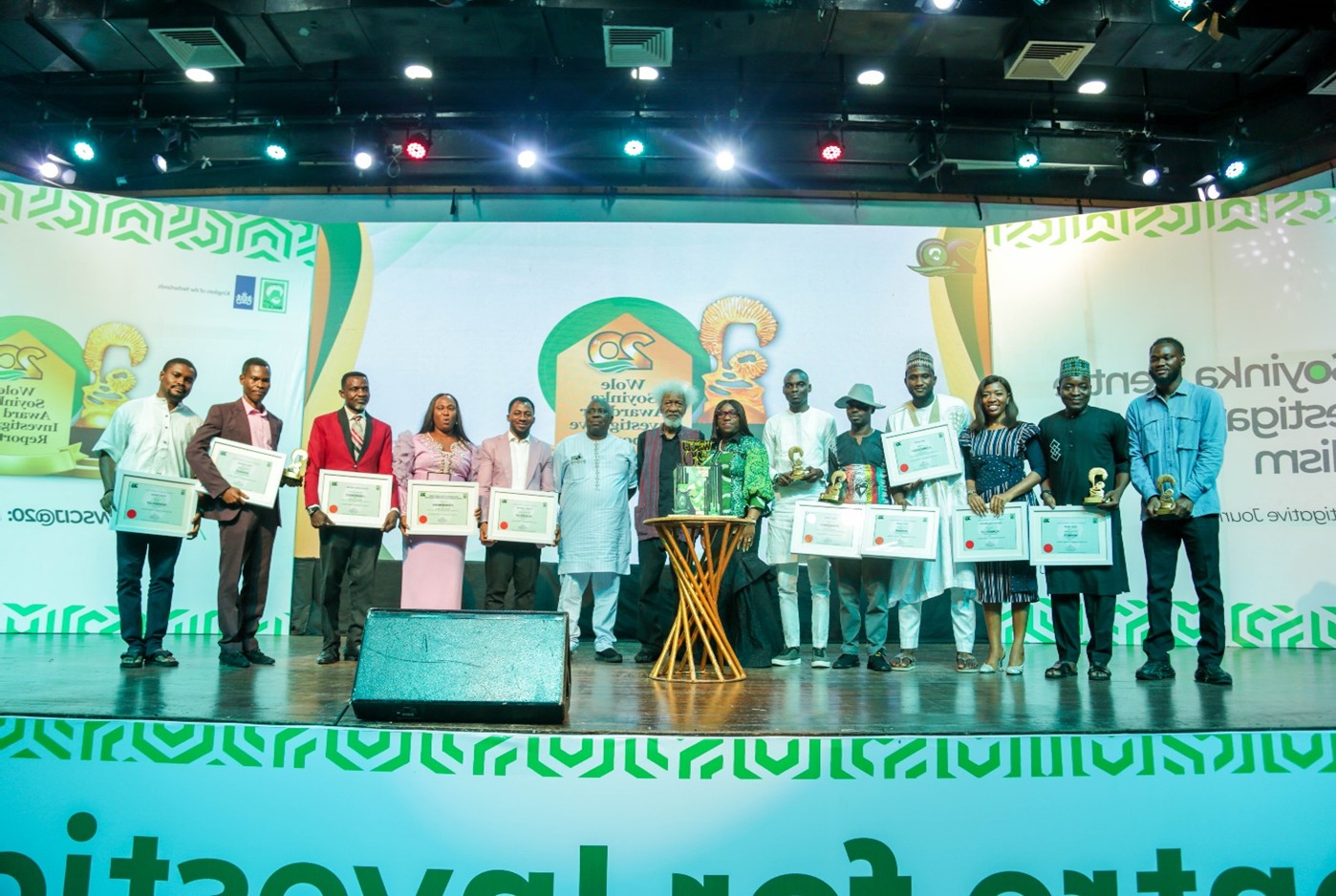 Finalists of the Wole Soyinka Award for Investigative Reporting on stage with their certificates and trophies at the award ceremony.