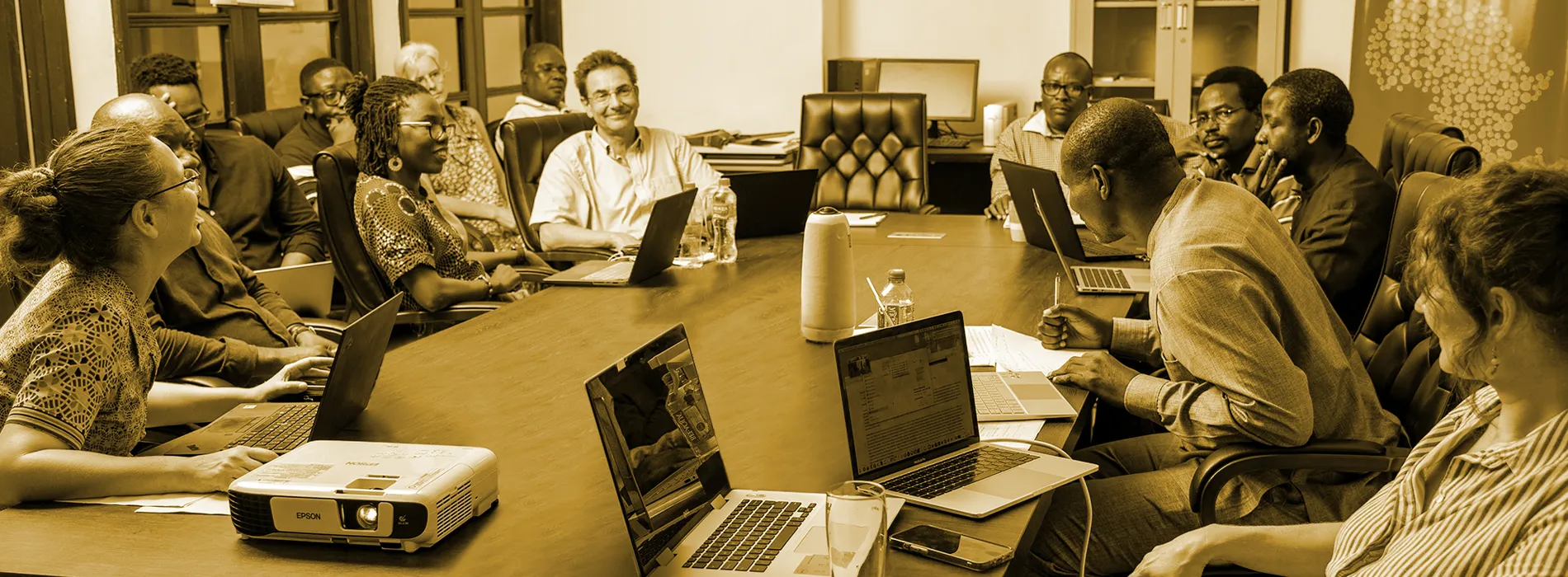 MIASA fellows in a working session around a conference table at the University of Ghana