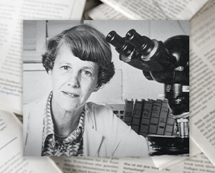 Cancer research pioneer Dr June L. Biedler at a microscope, after whom the AACR prize is named